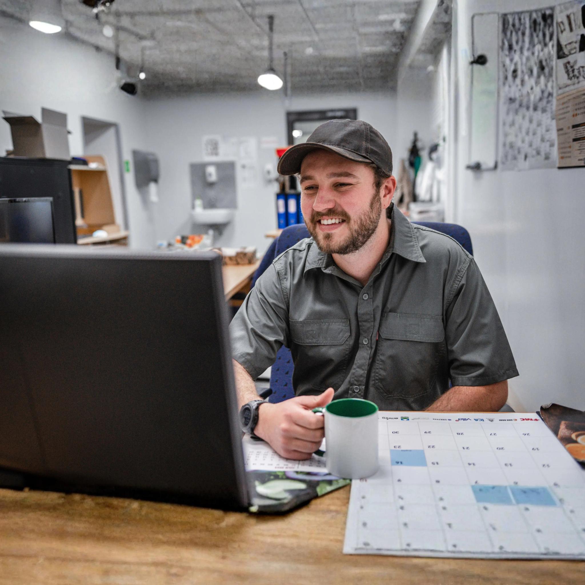 manager in front of laptop